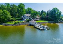 Expansive lakeside home featuring a private dock, gazebo, and stunning water views at 15 Old Stage Trl, Clover, SC 29710