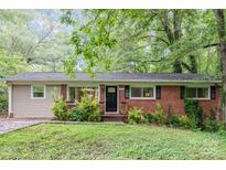 Charming one-story home featuring a classic brick facade and lovely landscaping at 205 E Cleveland Ave, Bessemer City, NC 28016