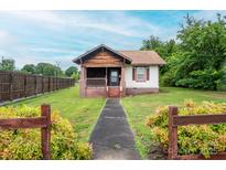 Charming single-story home with a walkway leading to the front door and a well-maintained lawn at 3 Circle Dr, Lincolnton, NC 28092
