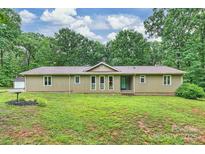 Charming single-story home featuring a large yard and a well-maintained exterior at 3017 Brooks Mill Ln # 10, Wingate, NC 28174