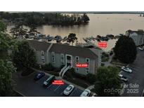 Aerial view of condo building with boat slip, parking, and lake access at 20417 Harborgate Ct # 510, Cornelius, NC 28031