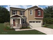 Charming two-story home with stone accents, neutral siding, and an attached two-car garage at 2648 Tillman St, Monroe, NC 28112