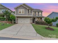 Charming two-story home with a two-car garage and inviting curb appeal at 755 Lagan Ct, Fort Mill, SC 29715