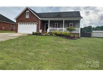 Charming single-story home with a well-maintained lawn and a welcoming front porch at 111 Brookview Dr, Shelby, NC 28152