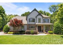 Charming two-story home with stone accents, manicured lawn, and a beautiful red maple tree at 3009 Botetourt Ct, Weddington, NC 28104
