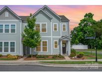Charming two-story home with a well-maintained yard and welcoming front porch, perfect for a cozy neighborhood at 355 Ladybird Ln, Pineville, NC 28134