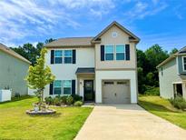 Charming two-story home with black shutters, a well-maintained lawn, and a beautiful front yard tree at 750 Fraternity Row, Kannapolis, NC 28081