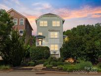 Charming three-story home with professional landscaping, fenced yard and inviting curb appeal at 807 Herrons Ferry Rd, Rock Hill, SC 29730