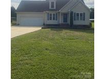 Charming single-Gathering home with a well-manicured lawn, attached garage and inviting curb appeal at 1083 Elljoy Ln, Salisbury, NC 28146
