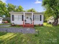 Charming single-story home with a well-maintained yard and a welcoming front porch area at 339 Arnold St, Rock Hill, SC 29730