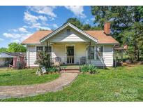 Charming single story home with a quaint front porch and landscaped front yard at 4059 10Th Avenue Sw Dr, Hickory, NC 28602