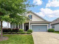 Charming home with beautiful landscaping, a two-car garage, and inviting curb appeal at 505 Belle Grove Dr, Lake Wylie, SC 29710
