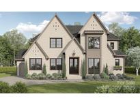 Stunning two-story brick home with symmetrical gables, lush landscaping and a welcoming front lawn at 608 Deodar Cedar Dr # 69, Matthews, NC 28104