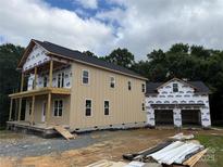 Two-story new construction with a two car garage and wood siding at 7217 Tesh Rd # 5, Monroe, NC 28110
