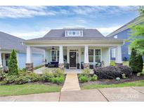 Charming single-story home with a covered front porch, stone accents, and landscaped yard at 109 Mac Aly, Cramerton, NC 28032