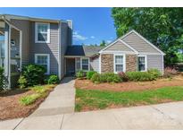 Charming townhome with stone accents, landscaped front yard, and inviting entrance at 1804 Fairlawn Ct, Rock Hill, SC 29732