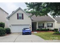 Charming two-story home with vinyl siding, manicured lawn, and an attached two-car garage at 2226 Elendil Ln, Charlotte, NC 28269