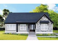 Charming single-story home featuring gray siding and stone accents, complemented by a well-manicured lawn and inviting front entrance at 3261 Enola Dr, Rock Hill, SC 29732