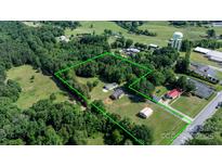 Expansive aerial view shows a large parcel of land surrounded by lush trees and greenery at 3423 S Hwy 127 Hwy, Hickory, NC 28602