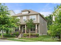Charming two-story home with well-maintained landscaping and inviting curb appeal at 15515 Laverack Ln, Davidson, NC 28036