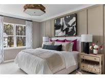 Beautiful bedroom featuring a large bed, modern lighting, and stylish decor elements at 2238 Endeavor Run, Charlotte, NC 28269