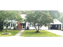 Charming single-story home with well-maintained landscaping and a welcoming front entrance at 423 N Cedar St, Lincolnton, NC 28092