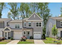 Charming two-story townhome with a well-manicured lawn and attached one car garage at 5324 Somerset Hill Ln, Charlotte, NC 28269