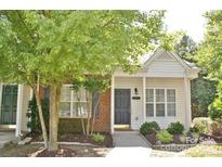 Charming exterior of townhome with well-maintained landscaping and covered front porch at 125 Lynch Cir, Mooresville, NC 28117