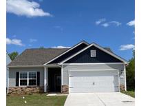 Charming single-story home featuring stone accents, gray siding, and a two-car garage at 1522 Doran Ter, Richburg, SC 29729