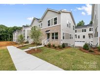 New two-story townhomes feature modern architecture, landscaped lawns and sidewalks at 3928 Hager Dr, Charlotte, NC 28208