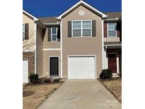 Charming townhome featuring attached garage, and neutral color scheme at 9170 Bradstreet Commons Way, Charlotte, NC 28215