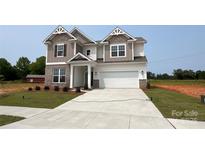 Beautiful two-story home with neutral color scheme and well-manicured lawn at 113 Tonbridge Way # Haf0031, Mooresville, NC 28115