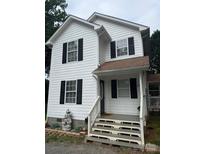 Charming two-story home with white siding, black shutters, and a welcoming front porch at 118 Fir St, McAdenville, NC 28101