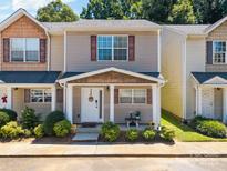 Charming townhome featuring a cozy front porch and well-maintained landscaping at 740 Tavern Ct # 7, Rock Hill, SC 29732