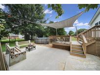 Enjoy outdoor living with a charming pool, deck and fire pit area, perfect for entertaining and relaxation at 842 Cherry S Rd, Rock Hill, SC 29732