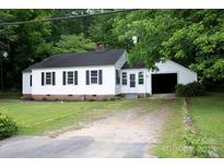 Charming single-story home with white siding, black shutters, and an attached one-car carport at 1250 Hampton Grace Ave, Lancaster, SC 29720
