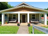 Charming covered front porch with seating, perfect for relaxing and enjoying the outdoors at 146 Georgia Sw St, Concord, NC 28025