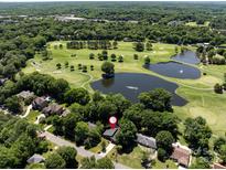 Stunning aerial view of the property overlooking a lush golf course and tranquil lakes at 3531 Bon Rea Dr, Charlotte, NC 28226