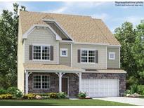 Charming two-story home featuring stone accents, a covered porch, attached garage, and lush landscaping at 4230 Skyboat Cir, Fort Mill, SC 29715