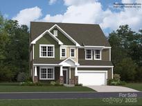 Inviting two-story home featuring a two-car garage and beautifully landscaped front yard at 4262 Skyboat Cir, Fort Mill, SC 29715