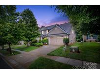 Charming two-story home featuring manicured landscaping and a spacious two-car garage at 4323 Bright Rd, Charlotte, NC 28214