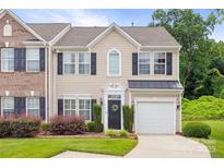 Charming two-story home with a one car garage, black shutters, manicured landscaping, and a welcoming entrance at 444 Battery Cir, Clover, SC 29710