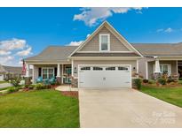 Charming home with a two-car garage, well-manicured lawn, and inviting front porch at 620 River Birch Dr, Salisbury, NC 28146