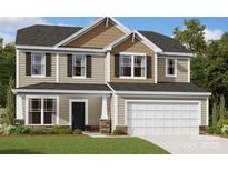 Charming two-story home featuring a two-car garage, neutral siding, black shutters, and a well-maintained lawn at 8610 Acadia Pkwy, Sherrills Ford, NC 28673
