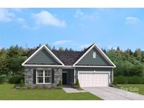 Charming home featuring stone accents, a two-car garage, and professionally landscaped front yard at 889 Exeter Dr, Sherrills Ford, NC 28673
