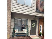 Charming home entrance with a wreath, bench, and welcome sign creating an inviting curb appeal at 2324 Brookview Ct, Rock Hill, SC 29732