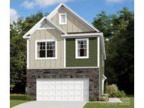 Charming two-story home with stone accents and attached two car garage at 3411 Secrest Lndg, Monroe, NC 28110