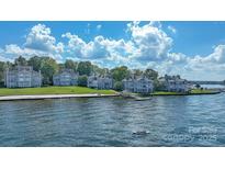 Waterfront condos with a beach and boat dock offer stunning views and easy access to water activities at 401 Lake Club Dr, Rock Hill, SC 29732