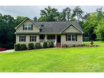 Charming two-story home with well-manicured lawn and an inviting covered front porch at 5369 Concord Rd, York, SC 29745