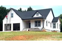 New construction home featuring white siding, dark roof, covered porch and an attached two car garage at 2589 Polo Ln, Maiden, NC 28650